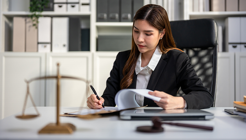 Attorney reviewing personal injury case documents in an office