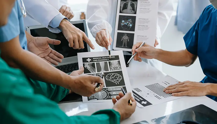Doctors reviewing healthcare records and imaging results
